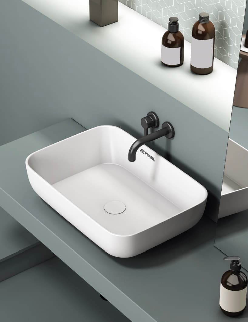 Modern white ceramic wash basin on wooden counter