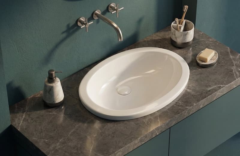 Modern ceramic basin on wooden countertop